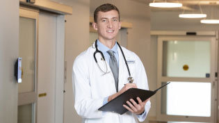 Medical doctor reviewing a patient chart.