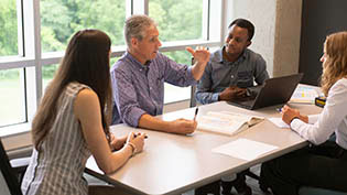 Preceptor interacting with students.