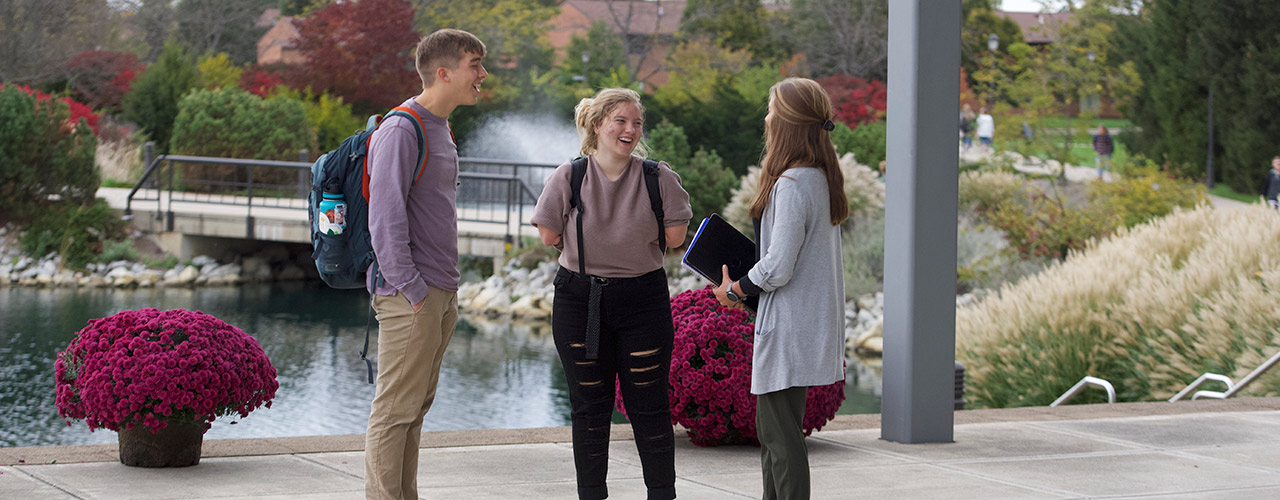 Marissa Conrad talks with friends in front of the BTS