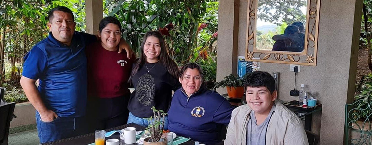Ligia Benitez with her family in El Salvador