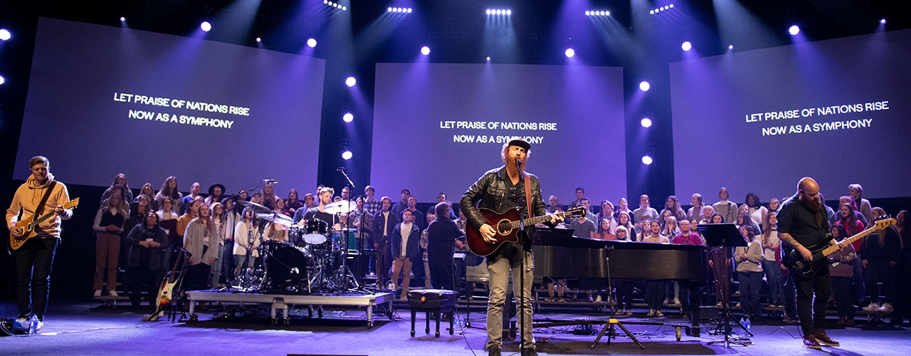 Matt Papa performing with Cedarville singers and musicians in concert in the Jeremiah Chapel