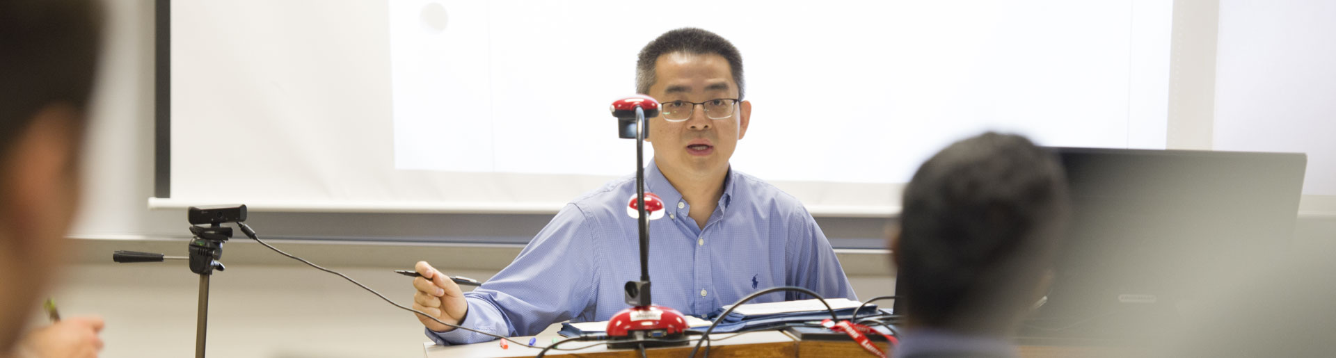 Dr. Yuan Meng listens as a student asks a question. Meng comes to Cedarville following stints at both Auburn and Mount Vernon Nazarene University.
