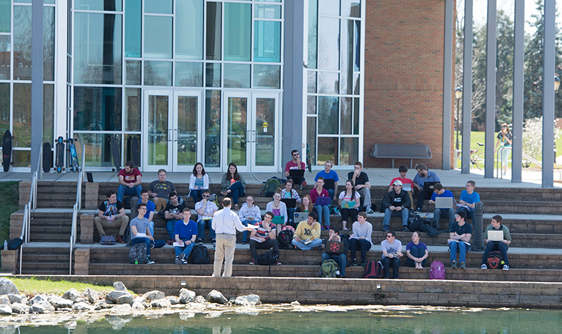 Class meeting on the steps BTS Building at Cedarville University