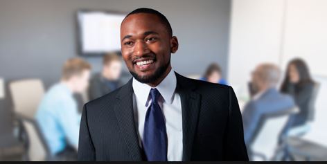 Man standing in front of business meeting