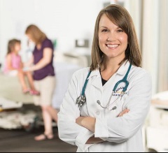 Nurse practitioner standing in front of patient.