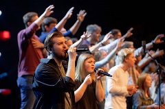 Group of people singing.