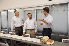 3professorsdiscussingtheTorahscroll