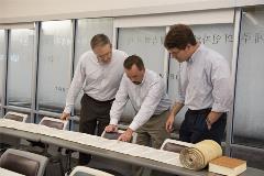 3professorspointingandlookingattheTorahscroll