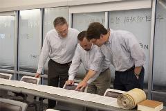 3professorspointanddiscusstorahscroll