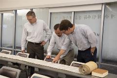 DrShepherdandDrLeepointatlineoftorahscroll