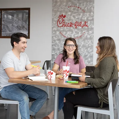 Three students studying at Chick-fil-A